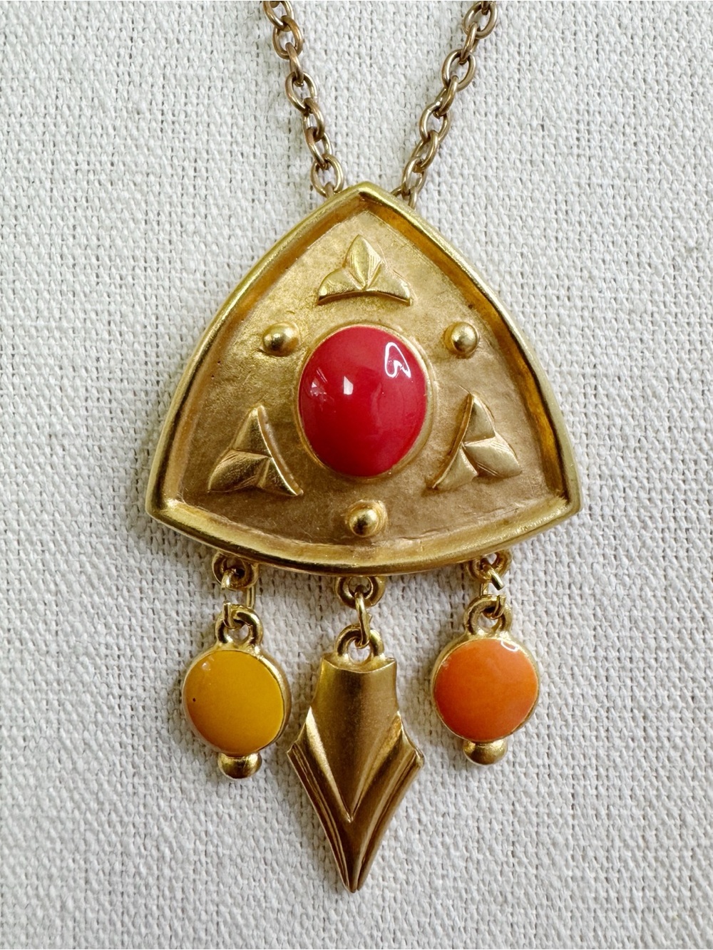 Gold-Tone Geometric Pendant Necklace with Red and Orange Accents